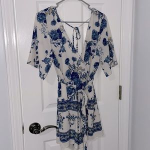 NWOT Trixxi of Macy’s: white romper with blue flowers. Size M